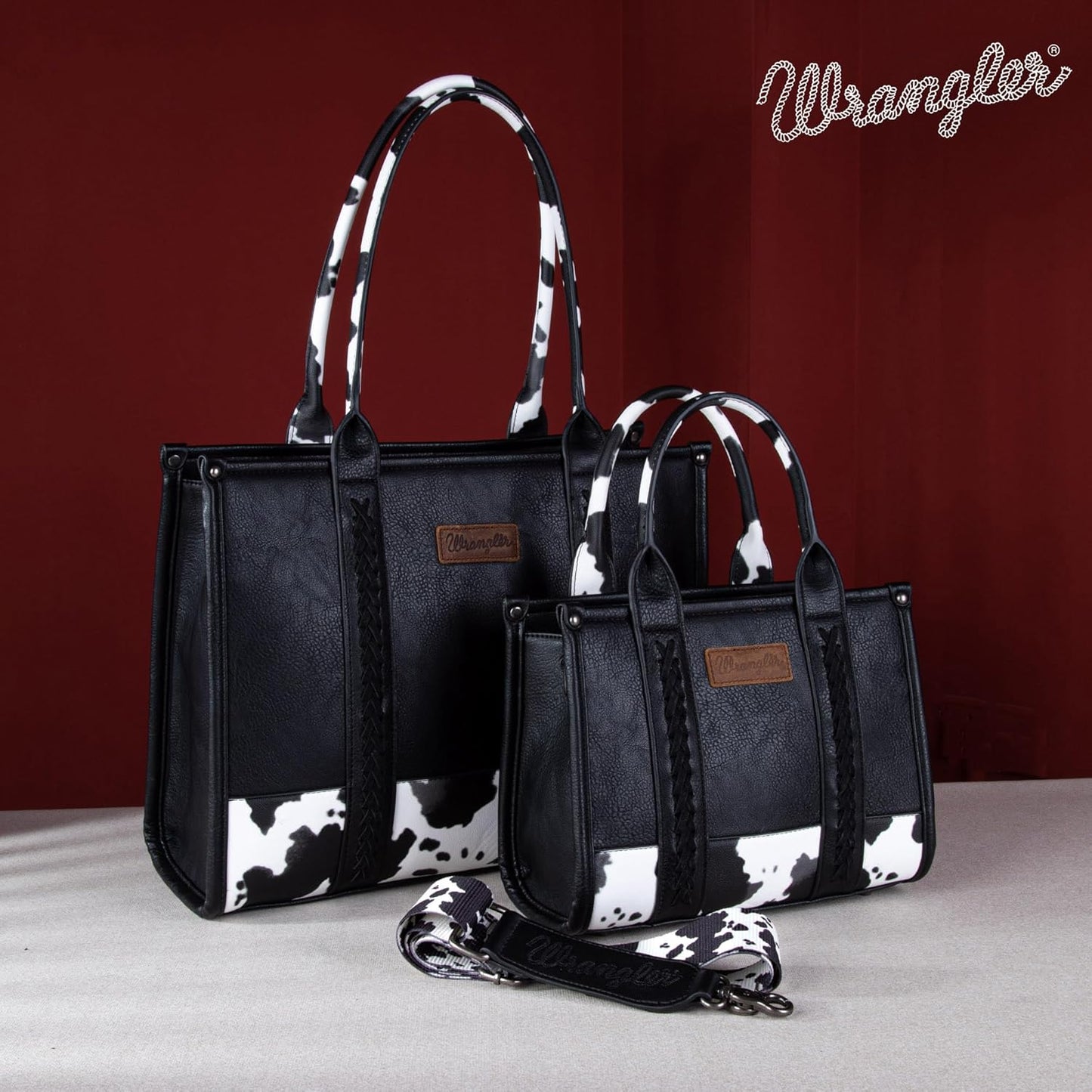 Bolsa feminina Wrangler com estampa de vaca e alça superior