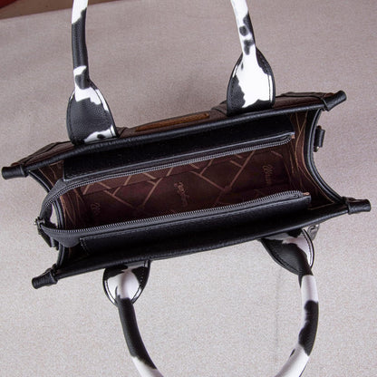 Bolsa feminina Wrangler com estampa de vaca e alça superior